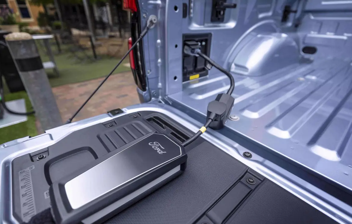 A charging unit in the bed of an F-150 Lightning Pro