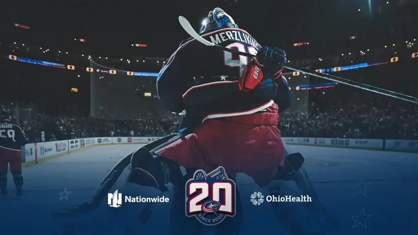 A Columbus Blue Jackets goaltender in a 20th anniversary graphic