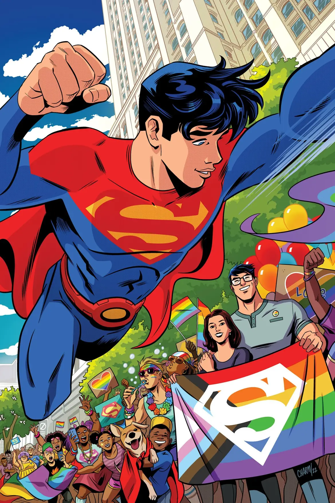 A Pride crowd holding a Superman rainbow flag
