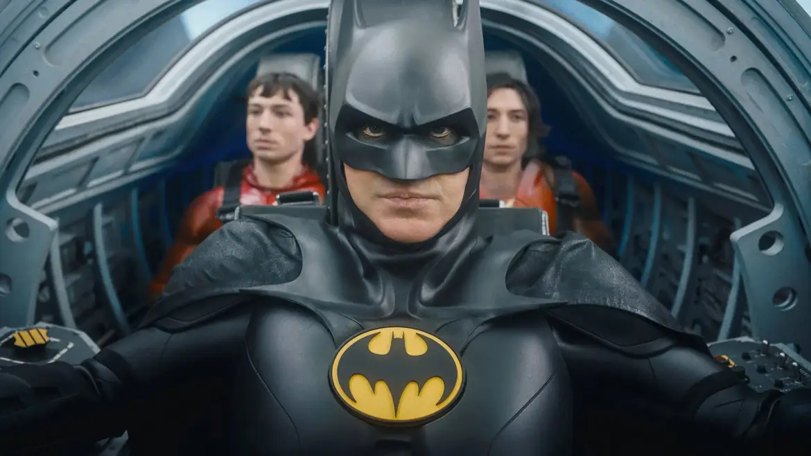 Batman in the cockpit with two Barry Allens