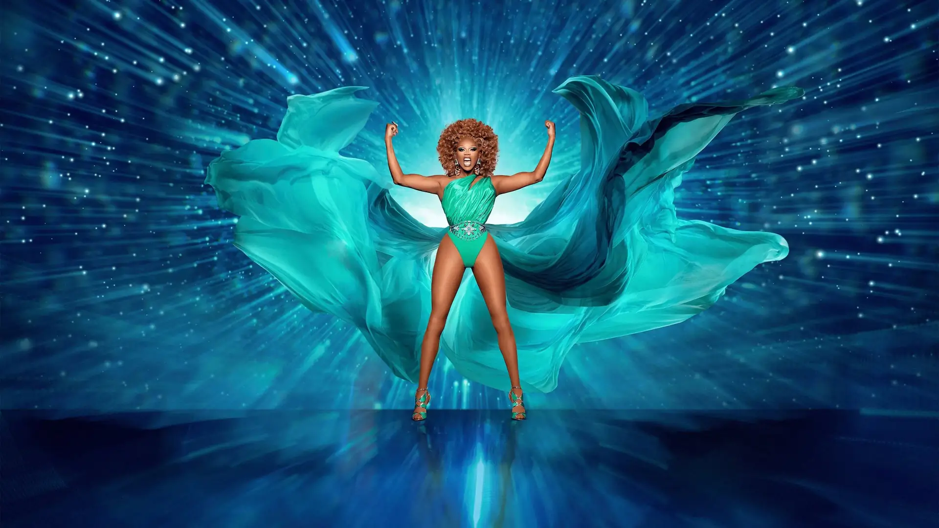 RuPaul with arms raised in front of a teal starburst