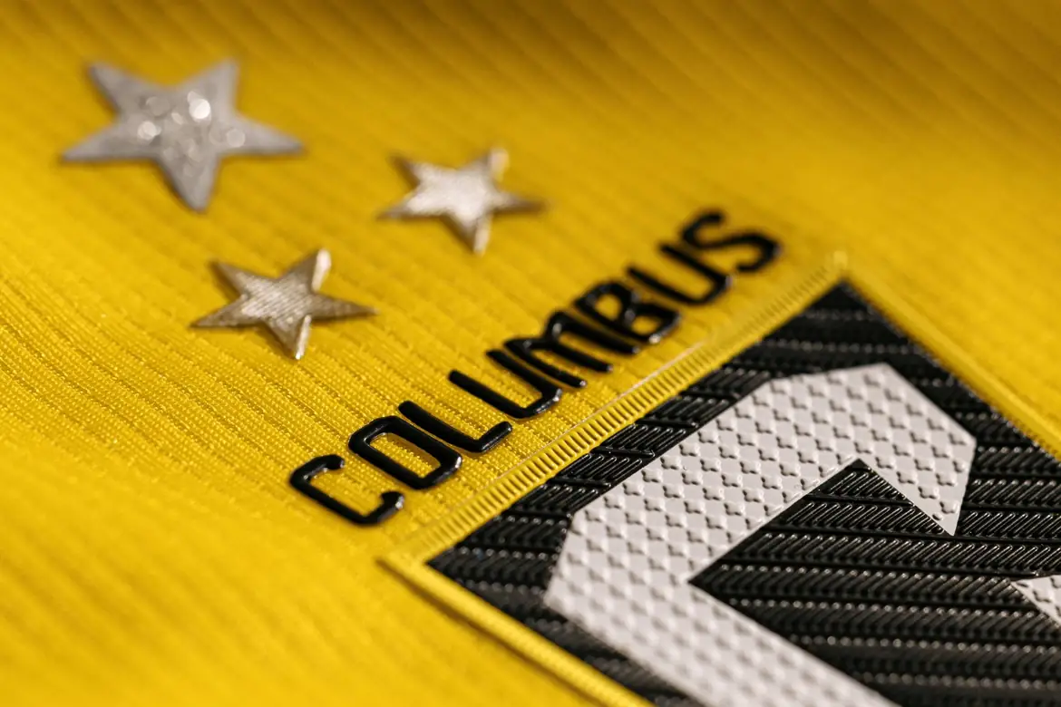 Detail of the Crew crest and stars