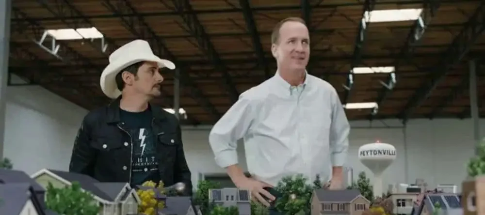 Peyton Manning and Brad Paisley in the model neighborhood