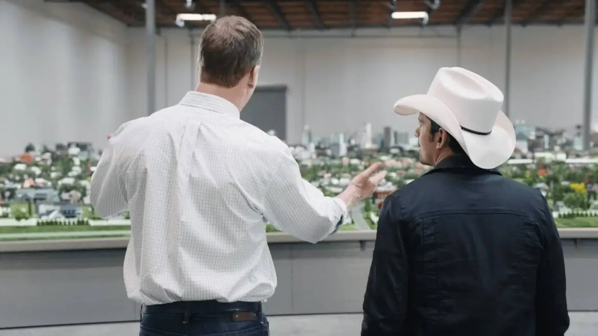 Peyton Manning and Brad Paisley looking over the Peytonville model town