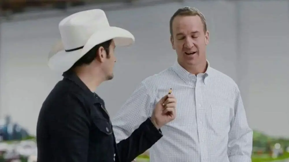 Peyton Manning and Brad Paisley mid-conversation