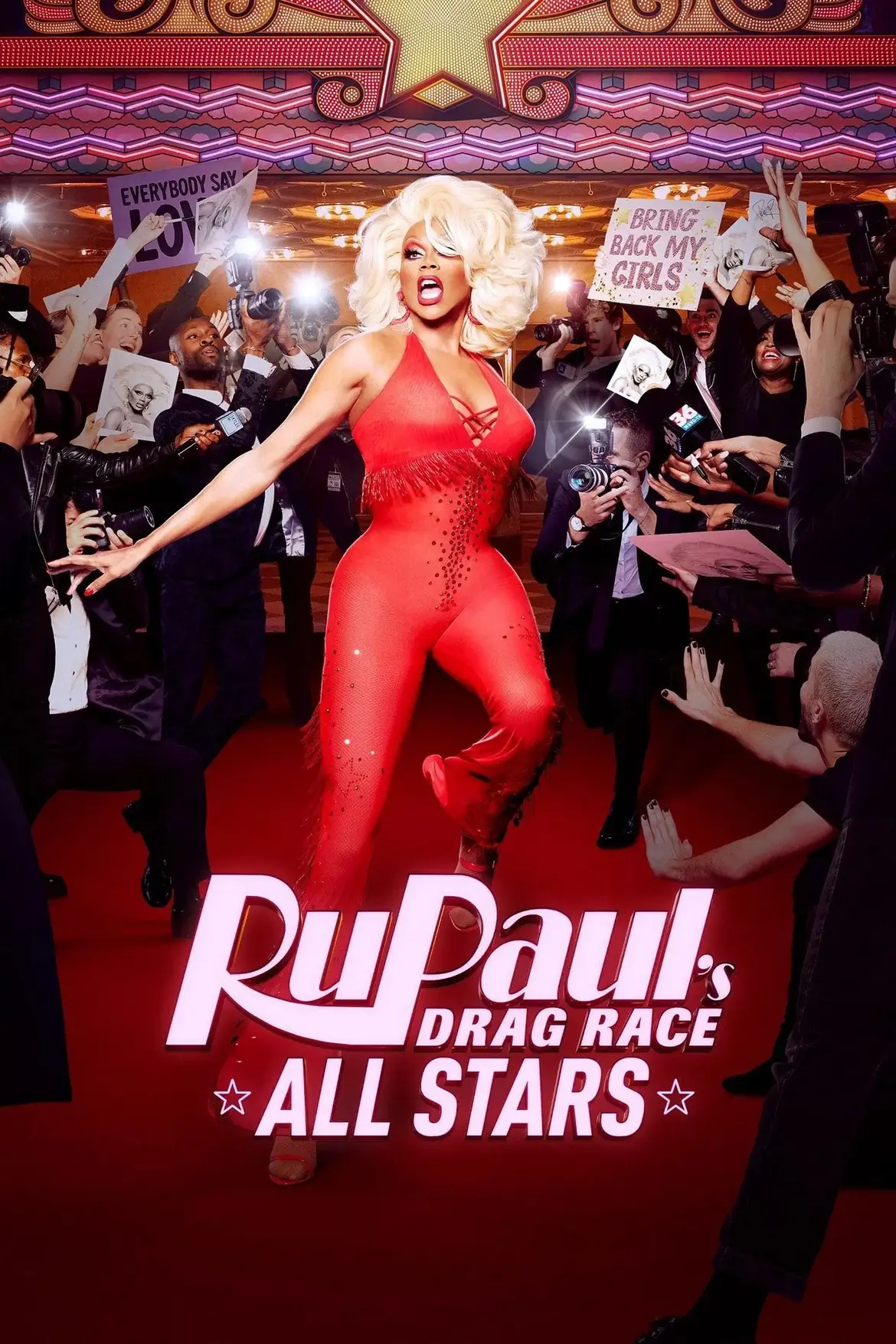 RuPaul on the red carpet in a red jumpsuit